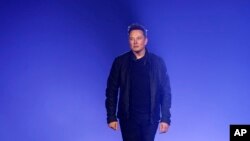 In this file photo, Tesla CEO Elon Musk introduces the Cybertruck at Tesla's design studio on Nov. 21, 2019, in Hawthorne, Calif. (AP Photo/Ringo H.W. Chiu, File)