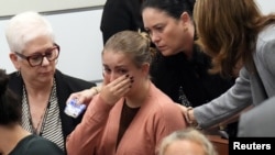 Meghan Petty is comforted as she takes a break from giving her victim impact statement during the sentencing hearing for Marjory Stoneman Douglas High School shooter Nikolas Cruz at the Broward County Courthouse in Fort Lauderdale, Florida, Nov. 1, 2022.