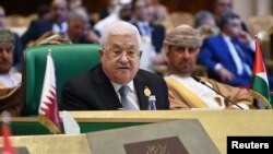 FILE - Palestinian President Mahmoud Abbas attends a session of the Arab League summit, Algeria, Nov. 2, 2022. (Algerian Presidency/Handout via Reuters)