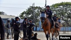 Mounted riot police leave the jail during ongoing prisoner transfers done as part of a government plan to reduce overcrowding in the country's prisons, in Guayaquil, Ecuador, on Nov. 1, 2022.