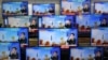 Television screens show a news report about the latest North Korean missile launch with file footage of a North Korean missile test, at an electronic market in Seoul, South Korea, Nov. 3, 2022. 