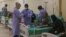 Health workers attend to suspected cholera patients inside a field hospital in Bebnine, Akkar district, northern Lebanon, Oct. 28, 2022. 
