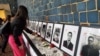 Photos of journalists killed for their work across the Americas in 2022 are displayed at an exhibition, "Memory and Voice," at the Organization of American States headquarters in Washington. (Tomás Guevara/VOA)