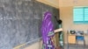FILE - A teacher leads her classroom in a school on the outskirts of Ouallam, Niger, on Oct. 26, 2022. Africa needs to recruit at least 15 million teachers by 2030 to address a shortage in primary and secondary schools, UNESCO says.