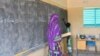 FILE - A teacher leads her classroom in a school on the outskirts of Ouallam, Niger, on Oct. 26, 2022. Africa needs to recruit at least 15 million teachers by 2030 to address a shortage in primary and secondary schools, UNESCO says.