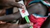 In this photo released by the World Food Programme (WFP) on Nov. 3, 2022, a woman is screened for malnutrition at a Nyong Primary Health Care Unit nutrition site in South Sudan where the WFP is offering supplementary feeding to children, pregnant and lactating women. 