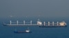 FILE - Cargo ship Rubymar, right, carrying Ukrainian grain, and cargo ship Stella GS, background-left, originating from Ukraine, sail at the entrance of the Bosphorus in the Black Sea off the coast off Kumkoy, north of Istanbul, Turkey, Nov. 2, 2022. 