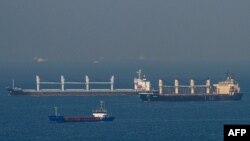 FILE - Cargo ship Rubymar, right, carrying Ukrainian grain, and cargo ship Stella GS, background-left, originating from Ukraine, sail at the entrance of the Bosphorus in the Black Sea off the coast off Kumkoy, north of Istanbul, Turkey, Nov. 2, 2022. 