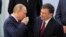O'zbekiston Bosh vaziri Shavkat Mirziyoyev (o'ngda) Rossiya Prezidenti Vladimir Putin bilan