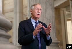 FILE - Sen. Angus King, I-Maine, is pictured during a TV interview on Capitol Hill in Washington, Dec. 9, 2014.