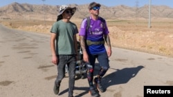 FILE - Spaniard Santiago Sanchez walks in Iraq's Kurdistan region en route to the 2022 World Cup in Qatar, Aug. 28, 2022. Sanchez has not been heard from since October 1, when he sent a photo to friends with a message that said "Entry to Iran." 