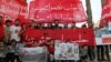 People hold banners during a sit-in in solidarity with the people of Aleppo in Idlib, Syria, May 4, 2016. The banner reads: "Oh, Aleppo, your victory is promised no matter how many crowds they bring to you."