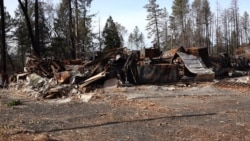 FIRE - In this photo from November 2019, a building in Paradise burned by the fire still stands, a reminder of the destructive force of the wildfire. (Elizabeth Lee/VOA News)