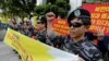 North Korean defectors shout slogans during a press conference demanding the improvement of North Korean's human rights, in front of National Human Rights Commission of Korea in Seoul, South Korea, Wednesday, Oct. 8, 2014.