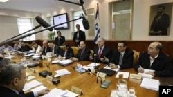 Israel's Prime Minister Benjamin Netanyahu, center, convenes the weekly cabinet meeting in Jerusalem, March 13, 2011