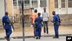 FILE- Police arrest a man following grenade attacks in the capital Bujumbura, Burundi Wednesday, Feb. 3, 2016.