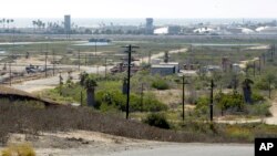 FILE - This Aug. 18, 2016 file photo shows Banning Ranch, including what remains of an oil-extraction operation, on what is believed to be the biggest piece of privately owned vacant land on Southern California's coast in Newport Beach.