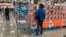 FILE - Shoppers wander the aisles of a Costco warehouse on Oct. 26, 2022, in Sheridan, Colo.
