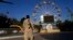 A Taliban fighter stands guard in an amusement park in Kabul, Afghanistan, Nov. 10, 2022. The Taliban have banned women from using gyms and parks in Afghanistan. The rule, which comes into force this week, is the group's latest edict cracking down on women.