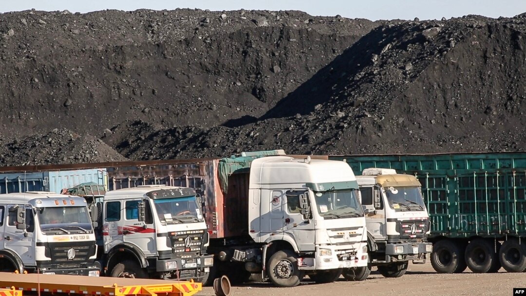 FILE - This video grab from footage taken on Oct. 16, 2021, shows coal to be loaded on trucks near Gants Mod port at the Chinese border with Gashuun Sukhait, in Umnugovi province, in Mongolia.