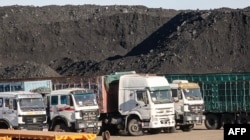 FILE - This video grab from footage taken on Oct. 16, 2021, shows coal to be loaded on trucks near Gants Mod port at the Chinese border with Gashuun Sukhait, in Umnugovi province, in Mongolia.