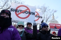 Federal air traffic controller union members protest the partial U.S. federal government shutdown at a rally at the U.S. Capitol in Washington, Jan. 10, 2019.