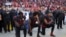 FILE - San Francisco 49ers outside linebacker Eli Harold (58), quarterback Colin Kaepernick (7) and safety Eric Reid (35) kneel during the national anthem before an NFL football game, Oct. 6, 2016.