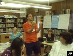 Peter Gaughan demonstrates a fluency exercise during a Singapore math training session.