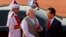 Indian Prime Minister Narendra Modi, center, talks to Vietnam's Prime Minister Nguyen Tan Dung, right, during a ceremonial reception at the forecourt of the Indian President's palace in New Delhi, Oct. 28, 2014.