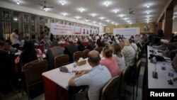 FILE - The Syrian Democratic Council meets in Tabqa, Syria, July 16, 2018.