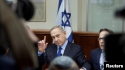 FILE - Israeli Prime Minister Benjamin Netanyahu attends the weekly cabinet meeting at his Jerusalem office, Dec. 25, 2016. 