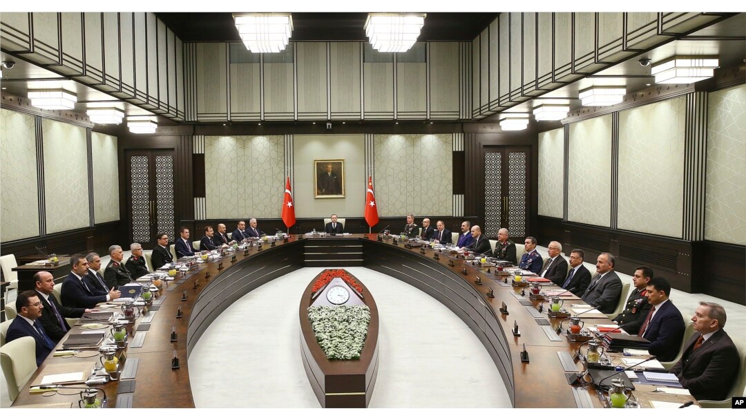 FILE - Turkey's President Recep Tayyip Erdogan chairs the National Security Council that met to recommend prolonging the state of emergency by a further three months, in Ankara, Turkey, Jan. 17, 2018. On April 18, 2018, Turkish lawmakers voted to extend the state of emergency through July — the seventh such extension since Ankara first implemented it after an attempted coup in July 2016.