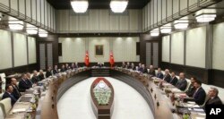 FILE - Turkey's President Recep Tayyip Erdogan chairs the National Security Council that met to recommend prolonging the state of emergency by a further three months, in Ankara, Turkey, Jan. 17, 2018. On April 18, 2018, Turkish lawmakers voted to extend the state of emergency through July — the seventh such extension since Ankara first implemented it after an attempted coup in July 2016.