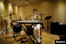 Japanese Miyu Takeuchi, a trainee with the K-pop agency Mystic Entertainment, sings during a training session in Seoul, South Korea, March 22, 2019.