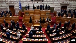 Newly elected Greek President Katerina Sakellaropoulou takes an oath during the swearing in ceremony at the Greek Parliament in Athens, March 13, 2020.