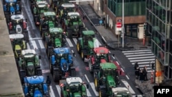 This photograph taken on Feb. 1, 2024, shows rows of tractors between buildings in the Belliard street during a protest action in the European district in Brussels.