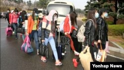 Thirteen North Korean workers who escaped an overseas North Korea restaurant and arrived in Seoul on April 7. South Korea's Unification Ministry announced several defections recently.