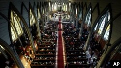 FILE - The Catholic Church officiates a reconciliation mass, which seeks to bring together all sectors of the community following the Church sex abuse scandal, at the San Mateo cathedral of Osorno, Chile, June 17, 2018. 