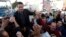 Ahmed Safadi, who won a seat in parliamentary elections, celebrates with his supporters in Amman, Jordan, January 24, 2013.