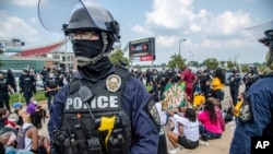 Louisville, Kentucky Metro police patrol during Black Lives Matter protest. 