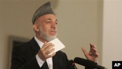 Afghan President Hamid Karzai speaks during a conference in Kabul, 20 Oct 2010