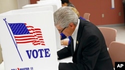 Republican Mississippi Gov. Phil Bryant casts his ballot, Nov. 3, 2015, in downtown Jackson, Miss. Mississippi.