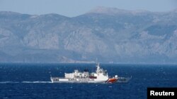 FILE -A Turkish coast guard ship patrols in the Aegean Sea, off the Turkish coast, April 20, 2016. 