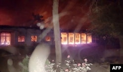 In this photograph released by Medecins Sans Frontieres (MSF) on Oct. 3, 2015, fires burn in part of the MSF hospital in the Afghan city of Kunduz after it was hit by an airstrike.