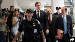 White House senior adviser Jared Kushner, center, accompanied by his attorney Abbe Lowell, right, arrives on Capitol Hill in Washington., Monday, July 24, 2017, to meet the Senate Intelligence Committee. (AP Photo/J. Scott Applewhite)