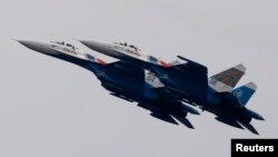Russian Air Force Su-27 Russkiye Vityazi (Russian Knights) jet fighters at air show outside Moscow (2011 photo)
