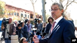 Attorney Robert Blume speaks to reporters outside federal court in Santa Ana, California, after an Afghan family of five who had traveled to the United States on special visas were detained on arrival, but were ordered released from custody March 6, 2017.