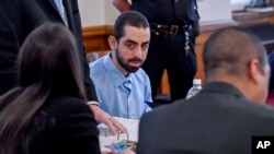 Hadi Matar, charged with severely injuring author Salman Rushdie in a 2022 knife attack, sits in Chautauqua County court before the start of jury selection in Mayville, New York, Feb. 4, 2025.