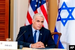 Israeli Foreign Minister Yair Lapid attends a news conference at the State Department in Washington, Oct. 13, 2021.