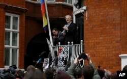 Wikileaks founder Julian Assange speaks on the balcony of the Ecuadorean Embassy in London, Feb. 5, 2016.